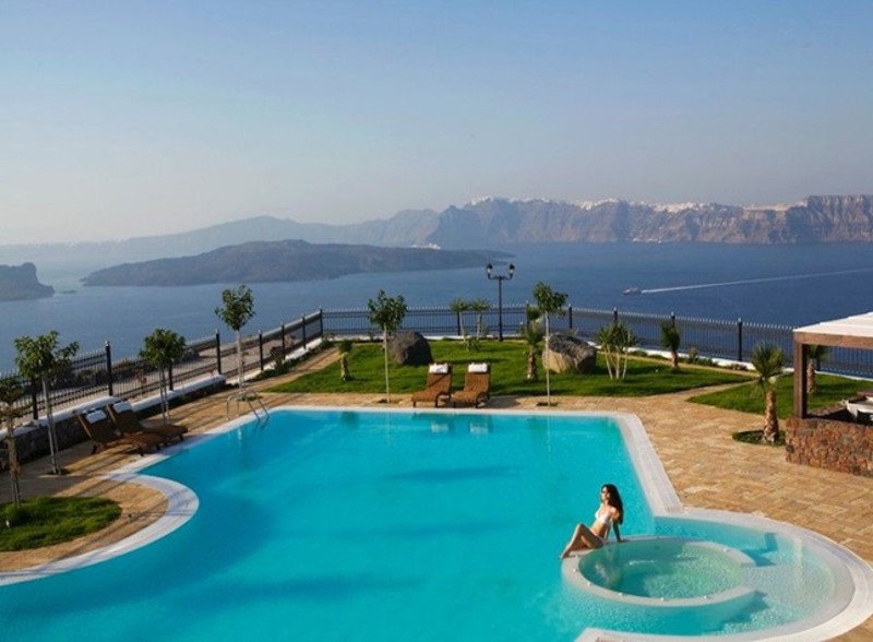 View of pool overlooking the sea at Maison De Lys