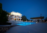 Glavas Inn. Outdoor Pool By Night