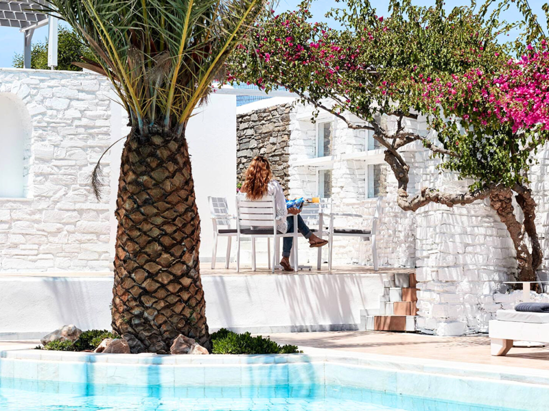 Dining by the pool at Mr & Mrs White Paros, Suites & More