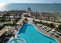 View of Pool and Beach at Supreme Hotel